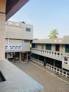a view of a large building with a courtyard at Tuxedo Hotel in Accra