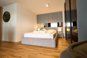 เตียงในห้องที่ Cartea Apartments Zürich Airport