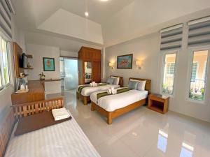 Postel nebo postele na pokoji v ubytování Chang Noi Hua Hin Pranburi fully accessible barrierefrei resort + 37 fotografií