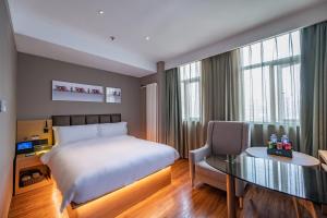 Voodi või voodid majutusasutuse True Go Hotel - Beijing Asian Games Village National Convention Center toas
