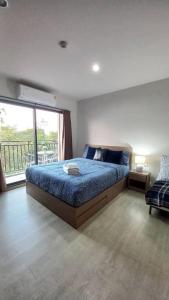 Postel nebo postele na pokoji v ubytování Happy Life at LacasitaD-HuaHin