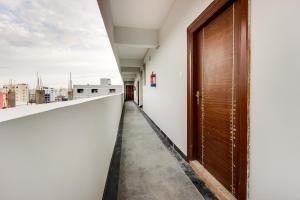 a corridor of an office with a door and a view at OYO SilverKey Oyo Silverkey ,near RTO office kondapur in Kondapur