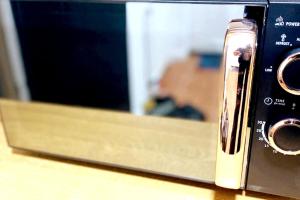 a close up of a toaster oven with a microwave at Gravesend - 1 bedroom Apartment in Kent