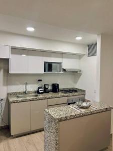 Ett kök eller pentry på Espectacular apartamento en Barranquilla