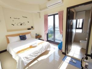 Krevet ili kreveti u jedinici u objektu Henchun Hope Homestay
