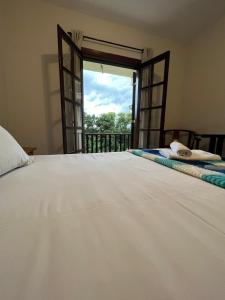 Ein Bett oder Betten in einem Zimmer der Unterkunft Villa Rural