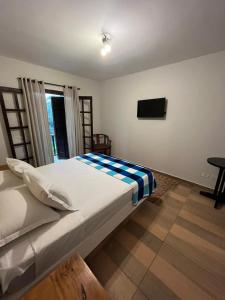 Ein Bett oder Betten in einem Zimmer der Unterkunft Villa Rural
