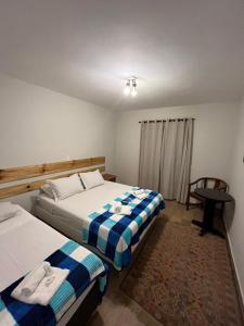 Ein Bett oder Betten in einem Zimmer der Unterkunft Villa Rural