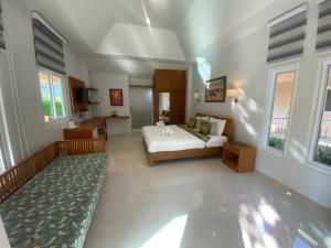 a large room with a bed and a bathroom at Chang Noi Hua Hin Pranburi fully accessible barrierefrei resort in Ban Nong Sua