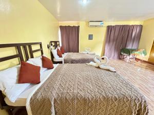 Postel nebo postele na pokoji v ubytování Elegance Guesthouse
