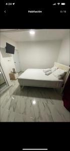 Ein Bett oder Betten in einem Zimmer der Unterkunft Apto con terraza