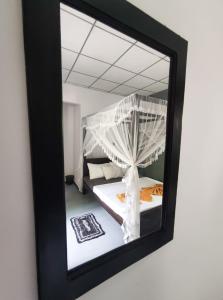 Postel nebo postele na pokoji v ubytování AURORA Midigama