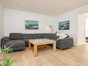 a living room with a couch and a coffee table at 4 person holiday home in Skagen in Skagen