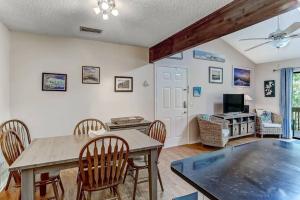 a dining room with a table and chairs at Amelia Island Paradise Rental! in Fernandina Beach