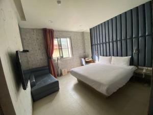 Postel nebo postele na pokoji v ubytování Love Hotel