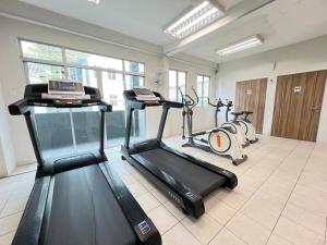 a gym with two exercise bikes in a room at AJ Homestay Near Kuching Airport in Kuching