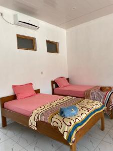 Tempat tidur dalam kamar di Rumah Budaya Sumba
