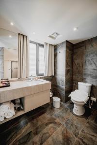Koupelna v ubytování Hub Hotel Kaohsiung Yawan Branch + 37 fotografií