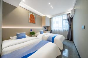 Voodi või voodid majutusasutuse Yue Lv Hotel toas