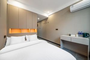 Voodi või voodid majutusasutuse Yue Lv Hotel toas
