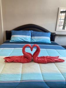 Postel nebo postele na pokoji v ubytování Sawasdee hatyai City House