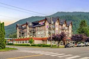 a large building on the side of a street at Modern 4BR Penthouse w/Lake Views & Rooftop Deck in Harrison Hot Springs