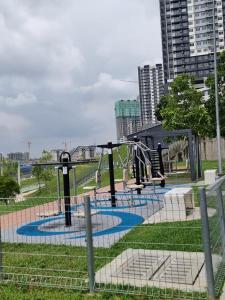 a playground in a park with a slide at ZIYAD AL KHAYR HOMESTAY in Kajang