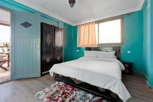 Postel nebo postele na pokoji v ubytování BAY Appartments Immssouane Bay 2 Bedroom Suite Ocean View Terrace