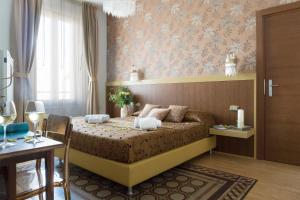 a bedroom with a large bed in a room at Residenza Mordini in La Maddalena +69 photos