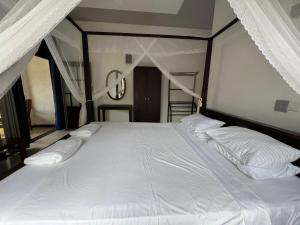 Кровать или кровати в номере Tanzanite place