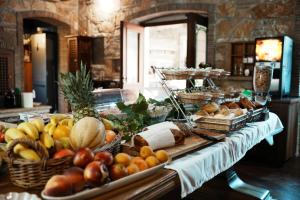 a buffet with many different types of fruits and vegetables at Villa Pasis in Rovinj