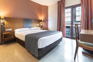Postel nebo postele na pokoji v ubytování Hotel Regio Cádiz