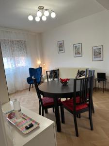 a dining room with a table and chairs in a room at Dario's House in Scandicci