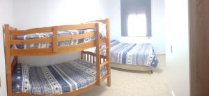 Postel nebo postele na pokoji v ubytování Apartamento El Niño de Oro