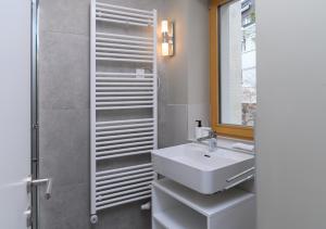 a bathroom with a sink and a shower at Primus apartments in Ljubljana +45 photos