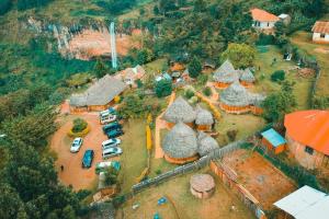 an aerial view of a house with cars in a parking lot at Sipi Falls Lodge in Sipi