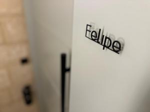 a white refrigerator with aidium sign on it at Felipe x Casa Norte in Birgu