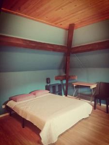 En eller flere senge i et værelse på Pour une halte aux portes de Bourgoin