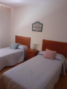 A bed or beds in a room at Isla de Tambo