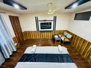TV a/nebo společenská místnost v ubytování Hotel Luxury Inn
