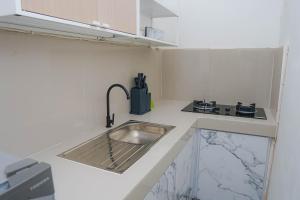 a kitchen with a sink and a counter top at Panorama cottages 1 #31 in Legian