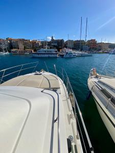 a boat is docked in a harbor with other boats at Stonda In Mare une parenthèse en mer in Propriano