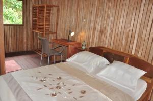 Letto o letti in una camera di Kribi-Lodge