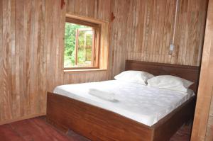 Letto o letti in una camera di Kribi-Lodge