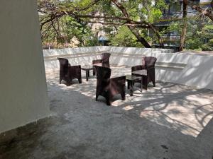 a group of chairs sitting around a table at Gokul Garden in Pune