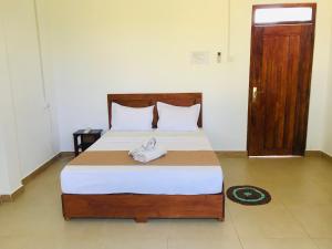 Postel nebo postele na pokoji v ubytování Rivonway Hotel Polonnaruwa