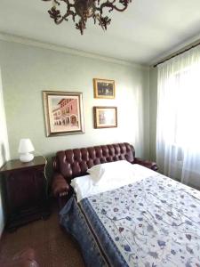 Postel nebo postele na pokoji v ubytování Giuditta Apartment