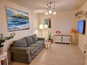 a living room with a couch and a table at Casa Romantica in Umag