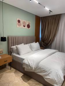 Cama o camas de una habitación en Luxury nile view apartment in maadi