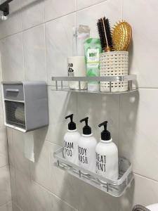 a shelf in a bathroom with toiletries and a microwave at Time House - Dongdaemun district in Seoul